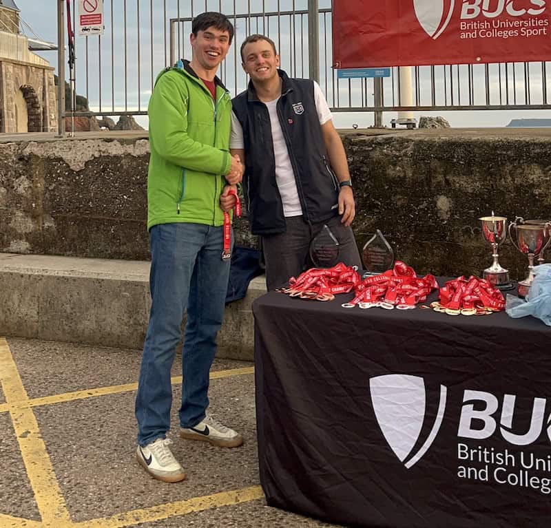 Tim Hire of Cambridge University collecting his second place medal at the BUCS fleet nationals 2024